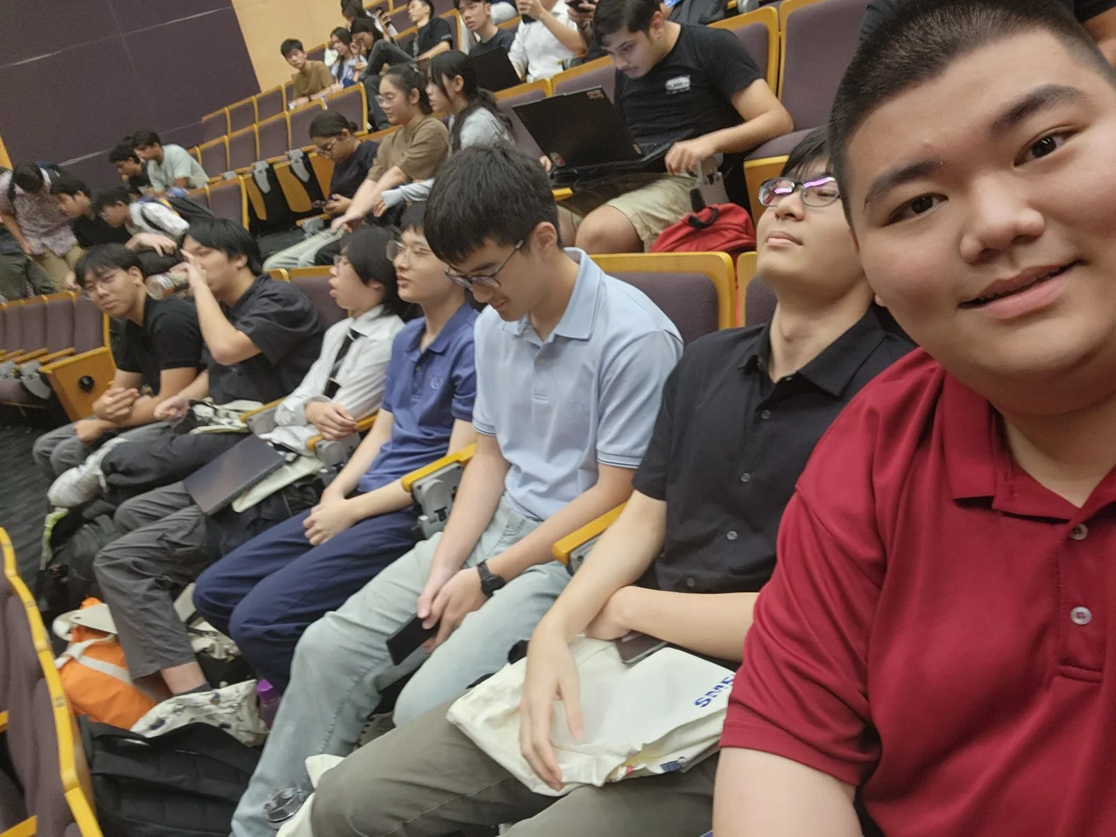 A selfie with classmates in a lecture theatre.