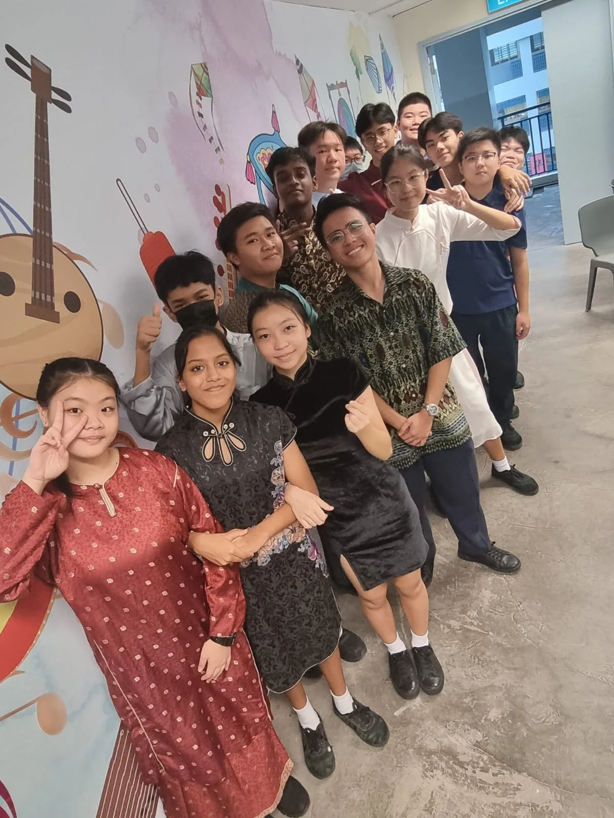 A group photograph in a school corridor.