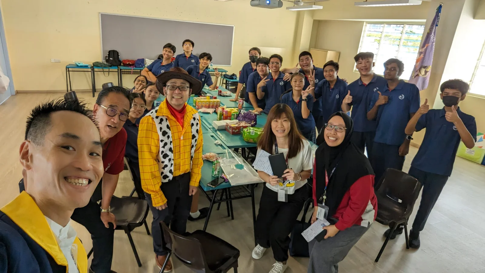 A group photograph in a classroom.